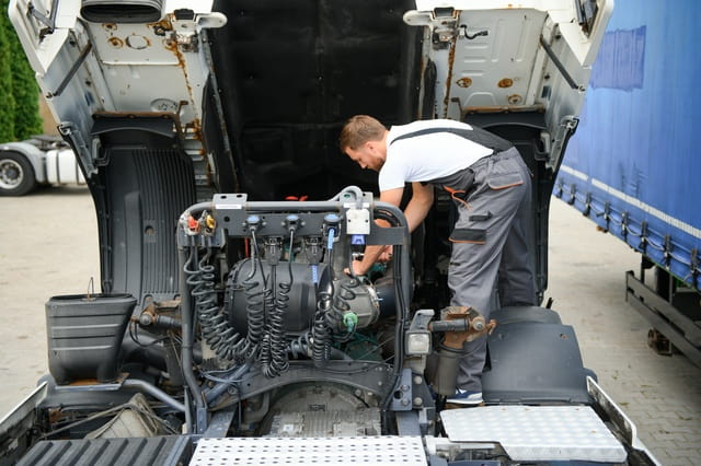 Road Service Semi Truck Mechanic image - repairing semi